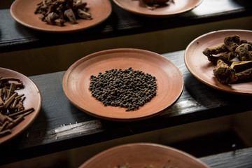 Allspice on dark rustic background.