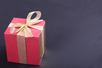 Gift boxes with bow on wood background