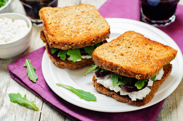 Roasted beet ricotta arugula rye sandwich
