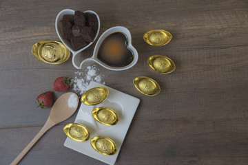 Coffee gold Strawberry on wood.