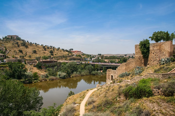 The slopes of the Tagus river , the view near the bridge of St. Martin in Toledo, Spain. May 2006