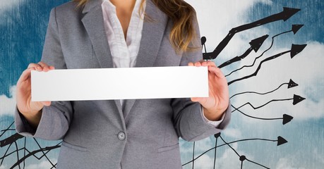 Businesswoman holding a sign against a blue background 