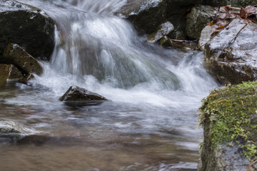 Fototapeta premium A small waterfall in the river.