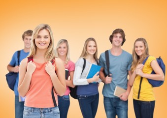 Obraz premium Students Smiling at camera against an orange background