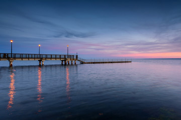 Fototapeta na wymiar Wooden pier in Kuznica at dusk. Baltic Sea. Poland. 