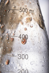 oil dripping down chemistry flask