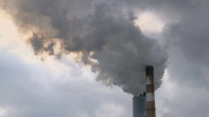 Smoke and yellow fumes billow fron chimney of coal powered power station in West Virginia