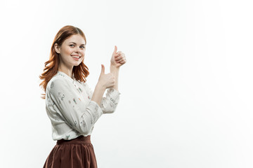 beautiful woman in a skirt gesticulating with her hands