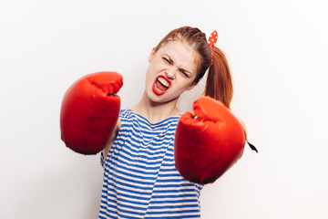 aggressive woman boxing gloves and in a striped T-shirt