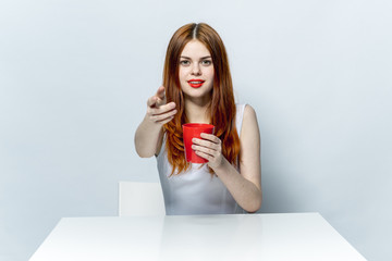 woman with a red mug in her hand