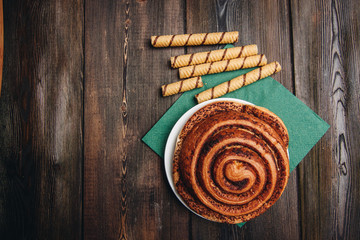 top view, a cinnamon roll and sweet rolls on a table