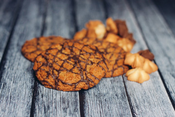 a variety of cookies on a wooden background