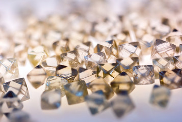natural transparent diamonds in macro with yellow reflection