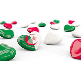 Heart with flag of algeria isolated on white