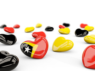 Heart with flag of east timor isolated on white