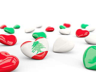 Heart with flag of lebanon isolated on white