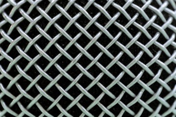 macro shot of microphone - diagonal pattern background.