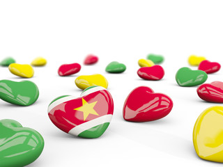 Heart with flag of suriname isolated on white