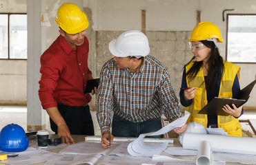 Team of business people in group, architect and engeneer on construciton site check documents and business workflow on new building