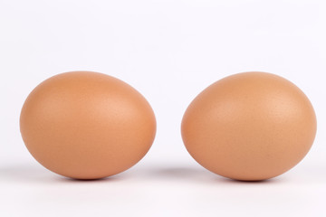Two eggs, isolated on a white background.
