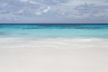 Fototapeta na wymiar White beach sand and beautiful blue sea and sky