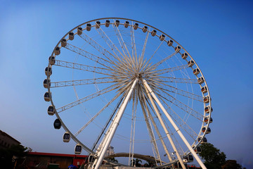 a fair ride during dusk on a warm summer evening