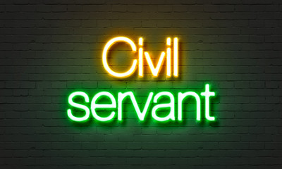 Obraz premium Civil servant neon sign on brick wall background.