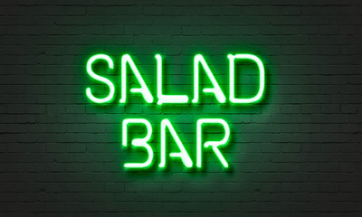 Salad bar neon sign on brick wall background.