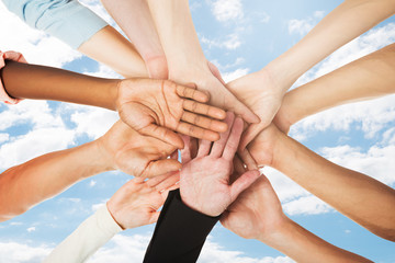Stacking Hands Against Sky