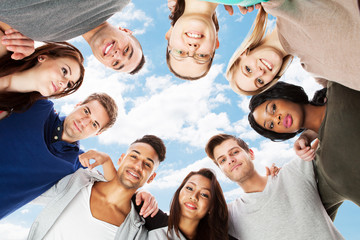 Confident College Students Forming Huddle