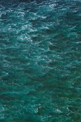 Tuinposter Indian ocean texture. Turquoise sea water with white foam. Powerful and peaceful nature concept. © yolya_ilyasova