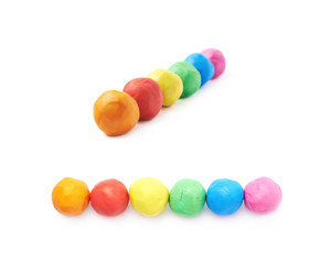 Lined up plasticine balls isolated