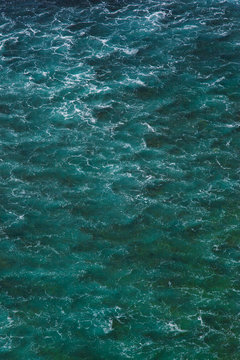 Fototapeta Indian ocean texture. Turquoise sea water with white foam. Powerful and peaceful nature concept.