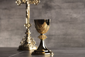 Chalice, Bible and altar cross.