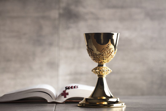 Chalice, Bible and altar cross.