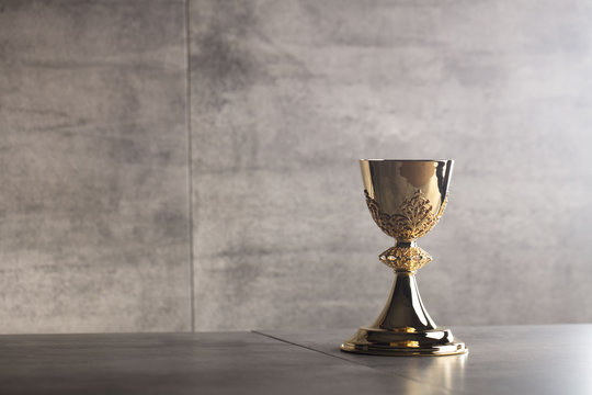 Chalice, Bible and altar cross.