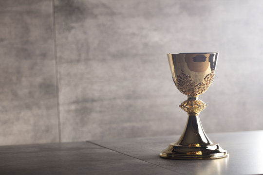Chalice, Bible and altar cross.