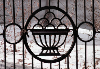 lattice fence in a city park in the winter
