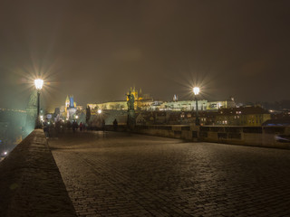 Fototapeta premium Prague, Czech Republic, walking on the Charles Bridge in the night. 
