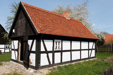 Fototapeta na wymiar Traditional rural building on sunny spring day. Poland