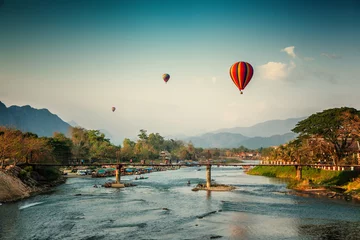 Foto op Canvas Beautiful views of the mountains and the balloon tour, landmarks travels Vang Vieng, Laos. © olezzo