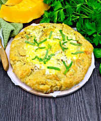 Pie of pumpkin and cheese whole on board