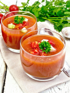 Soup tomato in two glasses with parsley on napkin