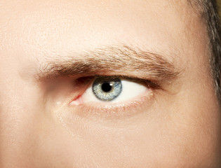 Image of man's blue eye close up.