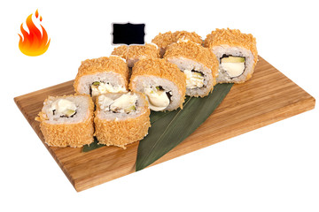 Sushi rolls on wooden Board with leaves of leeks and black sign for logo and name