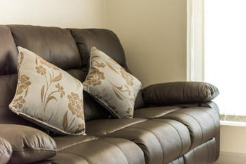 Fototapeta na wymiar Pillow on luxury gray sofa in a living room