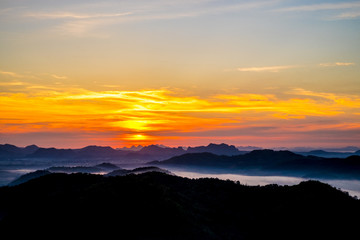 Fototapeta premium Beautiful Landscape of Sunrise with mist, sky and cloud shooting from top mountain at Phu Bo Bit, Loei, Thailand