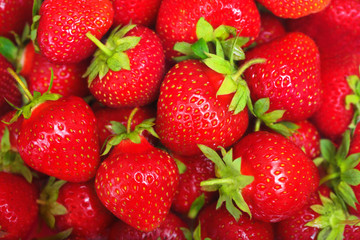 Bright background with fresh strawberries closeup.