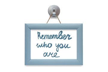 Remember who you are. Modern calligraphy. Motivational quote. Blue photo frame - isolated