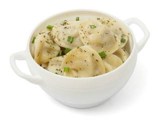 russian pelmeni on wood background on white